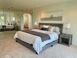 Wall to wall closets provide ample space