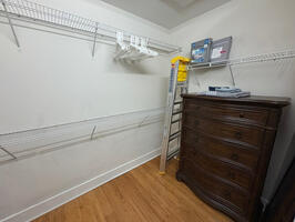 walk in closet with dresser and washer/dryer