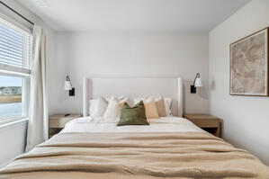 Serene retreat with olive green decor and soft textures.