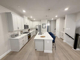 fully equipped kitchen with new appliances.