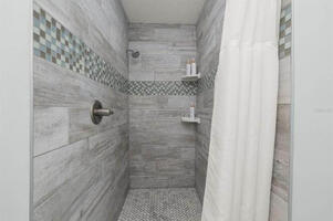 Clean and updated walk in shower in master bath