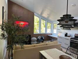 Vaulted ceilings, light-oak flooring