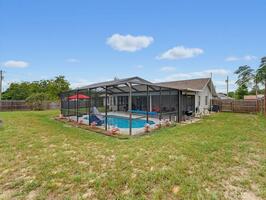 Backyard View of Screened Pool Enclosure