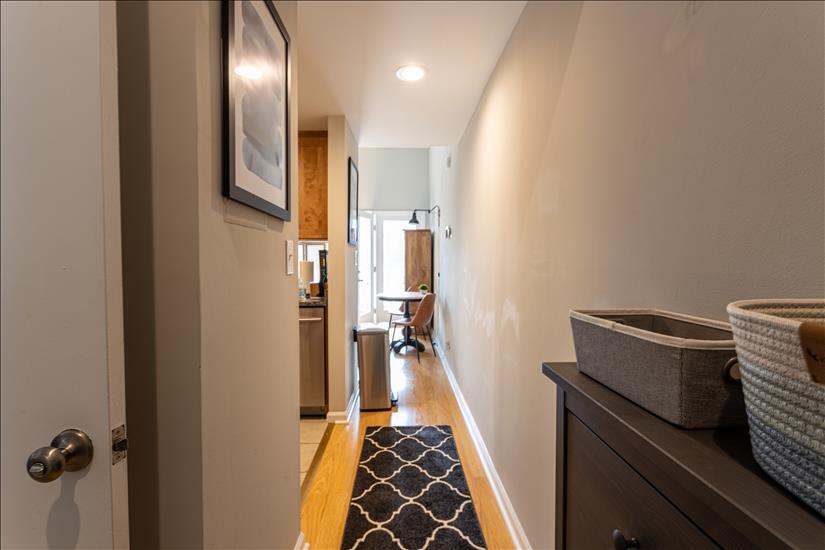 Entry has tile floor and baskets for keys, et