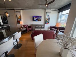 Open concept Living room dining room with ceiling fan