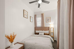 Queen bedroom with natural light