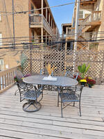 Unit 1 garage-roof deck with outdoor dining