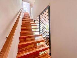 Stairs going upstairs to the 2 bedrooms