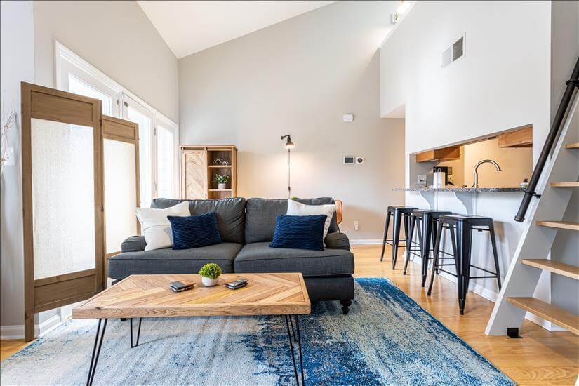 Open concept with bar seating and table for t