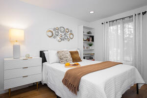 Upstairs bedroom with queen bed.