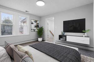 Master bedroom with TV and comfortable bed