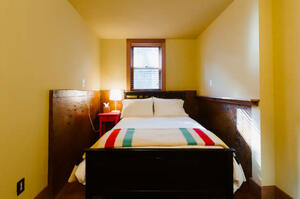 Full bedroom with books and toys