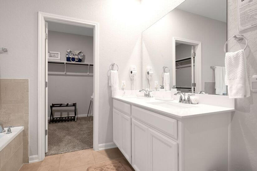Spacious walk-in closet next to master bathroom.