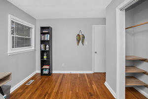 office main floor bookshelf and closet