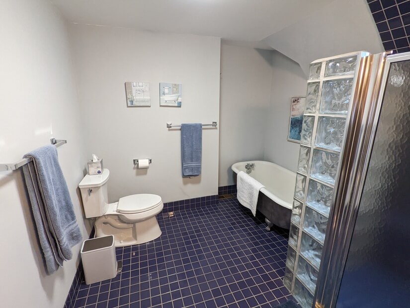 Master attached full bath with claw foot tub and lg shower