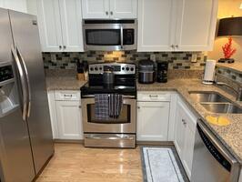 Ceramic tile backsplash, stainless appliances