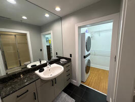 view of walk in closet from bathroom