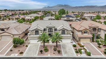 Front view of the house and dual driveways.