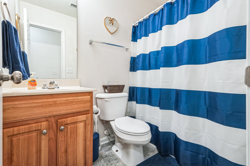 Secondary bathroom with shower and tub.