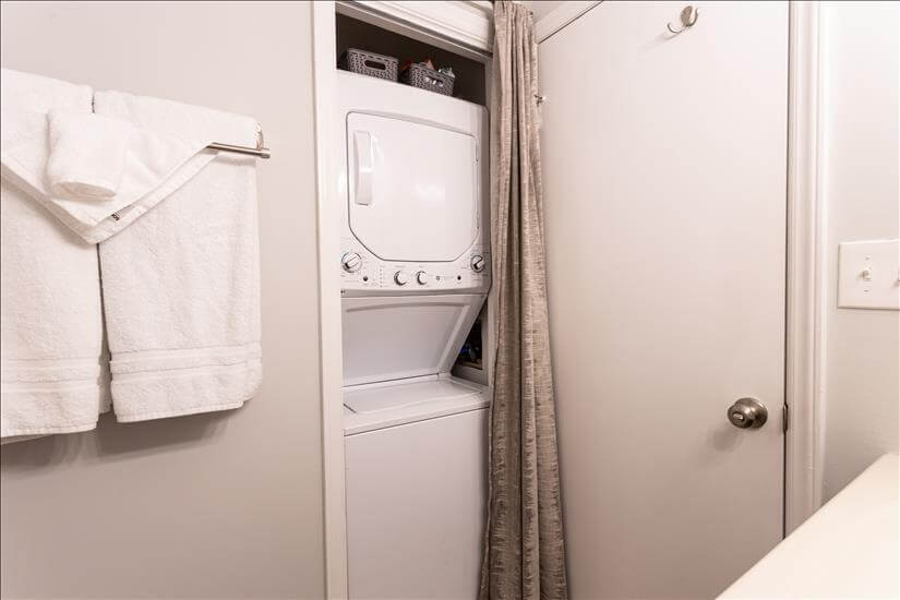 Brand new stacked washer and dryer