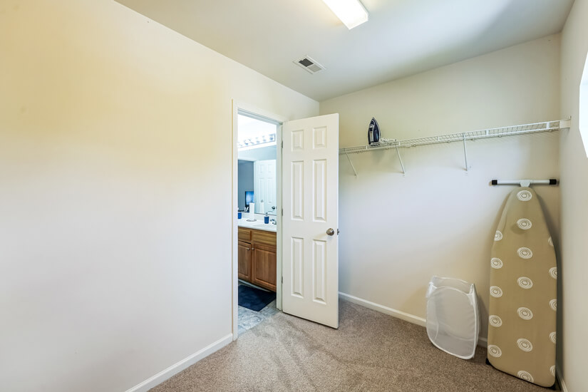 Primary bedroom large walk in closet .