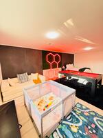 pool table and play kinds area with full bed