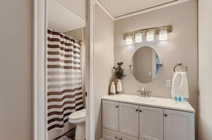 Clean, modern bathroom with lots of light and storage.