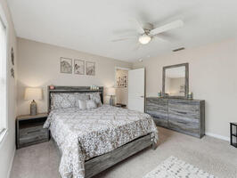 Furnished Guest Bedroom with Ceiling Fan