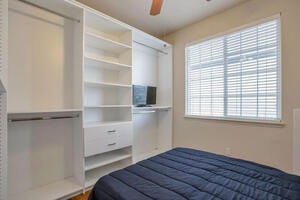 Bedroom with custom closet system