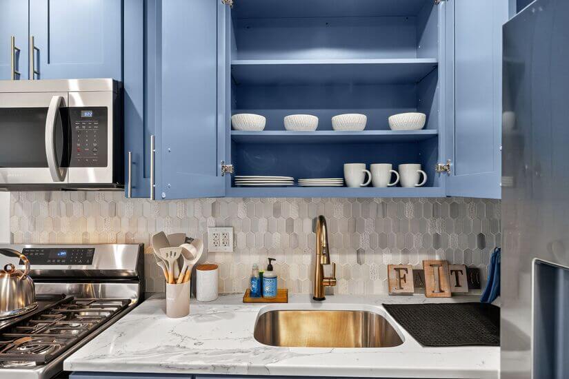 Kitchen with cooking utensils, plates, cups and bowls