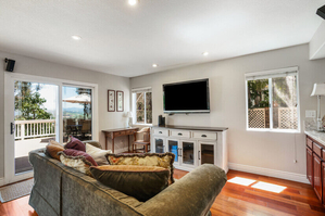 Family Room with Smart TV and Door to Patio