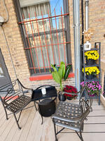 Unit 1 first-floor rear porch with seating