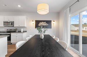 Dine in comfort with sleek chairs and a bold abstract area r