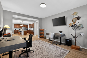 2  desks that convert to regular desk into a standing desk