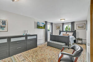 Bedroom with three dressers.