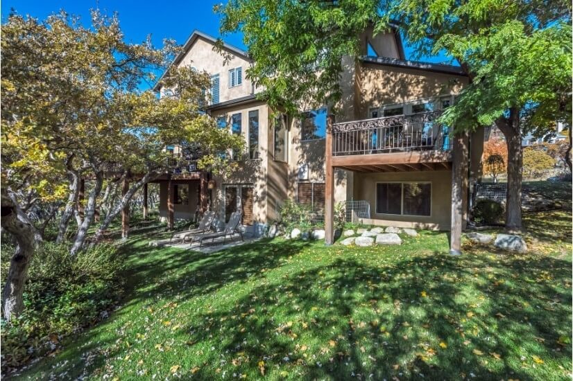 Private backyard w/ fountains, stone paths, patio and grass