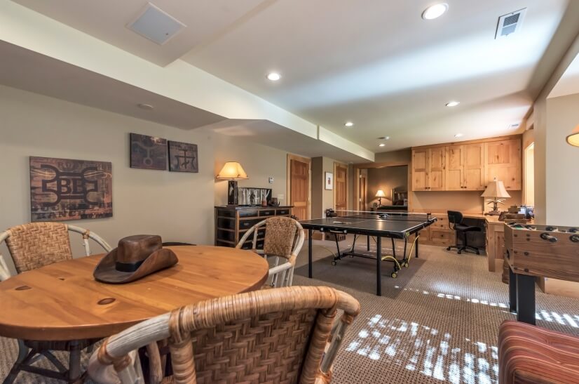 Sitting area with views of back yard, TV and gaming tables
