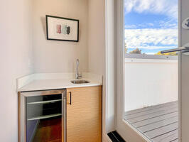 Mini fridge by rooftop deck for entertaining