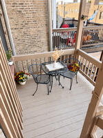 Third-floor rear porch with bistro seating