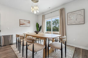 Dine under a chic chandelier at a sleek ash table