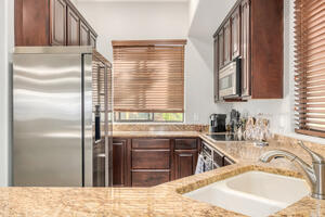 GE Fridge and kitchen area