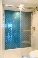 Walk-in shower with herringbone tile