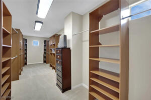 Primary Closet: has the shoot to laundry room.