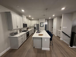 fully equipped kitchen with new appliances.