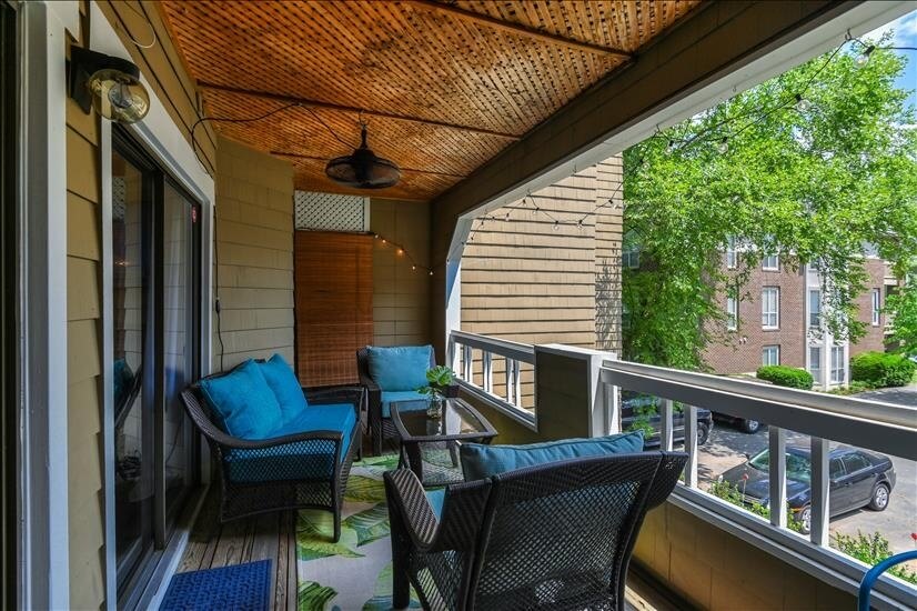 Comfortable patio with fan and bistro lights