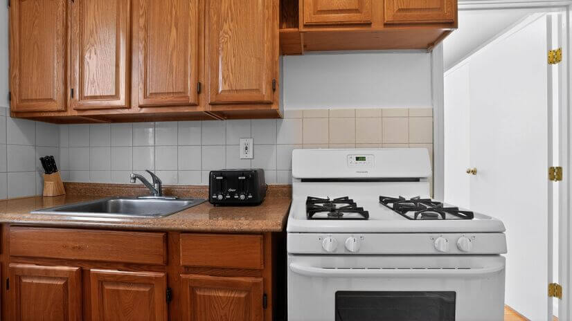 Clean & Functional Kitchen with Gas Stove and Prep Space