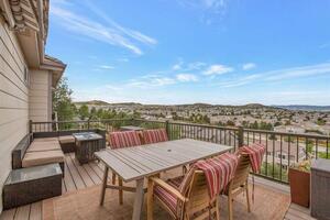 Private deck with dining set and valley views