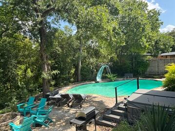 Backyard with pool and hot tub