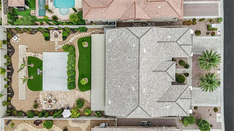 Drone view of the house, focusing on backyard