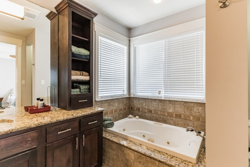 Master bath upstairs with jacuzzi and walk in shower